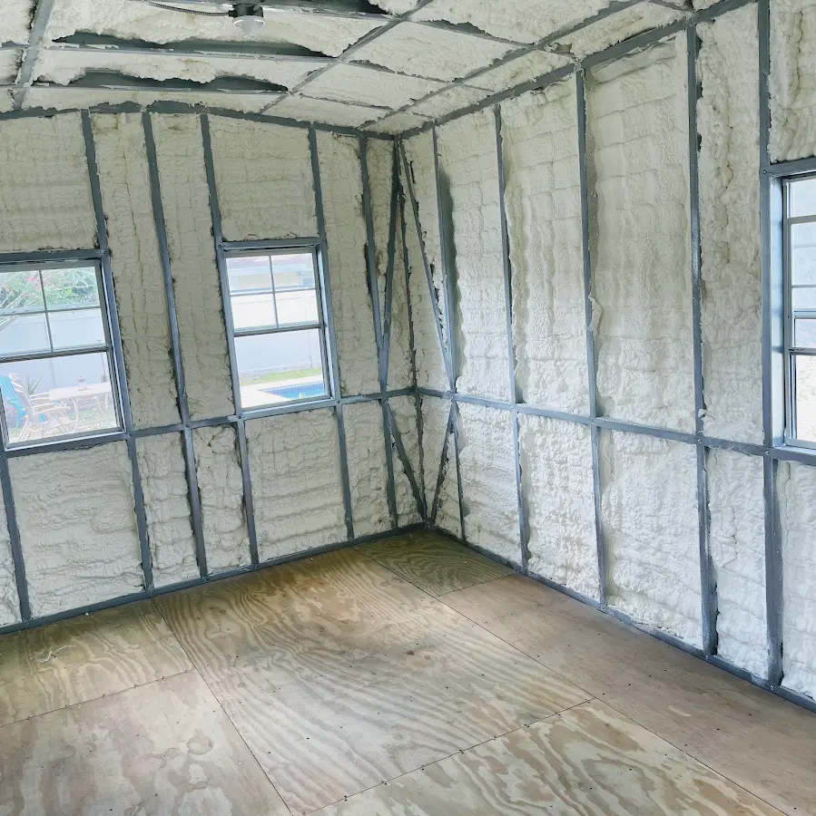 Closed-cell spray foam insulation applied to wall cavities in a residential project in Harrison